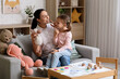 © Pixel-Shot - Female speech therapist with toy sheep and little girl pronouncing letter in office