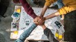 © AI Clips - Teamwork and collaboration hands joined over a table with a lightbulb idea sketch
