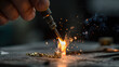 © Valena - Jeweler soldering delicate gold chain link with precision torch flame