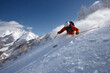 © krasyuk - Skiing down a snow-covered mountain slope in bright sunlight on a clear winter day