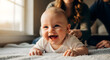 © pjdesign - Portrait of a cheerful infant with first teeth laughing and crawling on a soft rug in a bright living room
