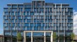 © Rumput - Modern architectural marvel - A contemporary building with intricate facade design.