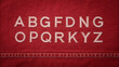 © Silaya Elena - Denim font with red background and stitching