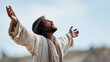 © GrayFrog - Jesus Christ with crown of thorns raising arms in prayer under bright sky as symbol of faith, sacrifice and resurrection.