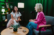 © oneinchpunch - Content creators broadcasting live podcast interview using microphones