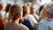 © Denis Yevtekhov - Audience in small classroom adult students listening to professor, group of professionals in audience, rear view sitting people business concept, faceless attendees, defocused background, with