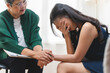 © Pormezz - Young woman in a mental therapy session talking with a psychologist in the office.