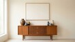© photoplotnikov - Mid-century modern wooden sideboard with ceramic vases and minimalist art in bright interior
