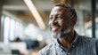 © Chaiwit - Smiling national employee celebrates appreciation day with positive energy in modern office environment showing happiness and confidence