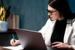 © Лиза Птицына - Woman in professional attire working in office. Business concept.