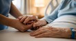© MdAsiful - Tender moment of caregiver holding hands with elderly person