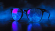 © Diana - photo of a pair of modern glasses the lenses feature a sharp vivid reflection computer programming binary code in neon blue with smoke bokeh background with copy space for campaigns hd quality