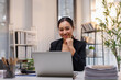 © David - Asian young woman working with laptop in her office. business financial concept.