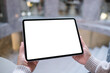 © Farknot Architect - Mockup image of a woman holding digital tablet with blank white desktop screen