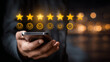 © Atchariya63 - Customer experience online review five star rating feedback concept smartphone user satisfaction service quality rating scale glowing icon emotion