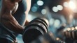 © ttonaorh - Close-up of strong athletic man performing dumbbell curls in gym