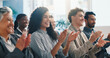 © WesJVR/peopleimages.com - Seminar, smile and applause with business people for celebration, thank you and well done. Clap, conference and happy audience at workshop for achievement, excellence and success in corporate office