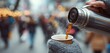 © Robi - Close-up of hot coffee being poured from a thermos into a paper cup on a cold winter day.