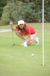© auremar - woman golfer feeling disappointed after golf ball missed the hole