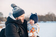 © phpetrunina14 - Father and Baby in Winter Landscape Copy Space