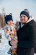 © phpetrunina14 - Father and Baby in Winter Landscape Copy Space