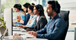 © P2000/peopleimages.com - Call center, computer and man in office, help desk an communication with advice. Employees, consultation and people with pc, coworking and contact us with conversation, crm and customer support