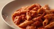 © The 2R Artificiality - Vegan penne pasta immersed in a luscious vodka tomato cream sauce