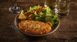 © Giovanni - Delicious fish cutlet with garden salad and zesty lemon paired with a glass of white wine resting on aged wooden surface