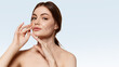 © master1305 - Modern poster woman portrait touching face with facial grid overlay. Concept of personalized skincare program visualization, cosmetic assessment service and medspa branding content.