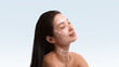 © master1305 - Elegant mixed media relaxed woman portrait with facial grid overlay. Concept of skin tightening treatment promotion, medspa branding materials and high tech cosmetic service marketing.