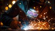 © HPMP Studio - Welder in Action with Sparks Flying.