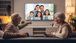 © Semesta Stock Visual - Senior Couple Smiling Back At Camera While Video Calling Family At Home