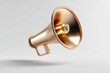 © Zabi - A sleek, highly polished golden megaphone, featuring a shimmering metallic finish, elegantly floats with a subtle shadow against a minimalist light grey background.
