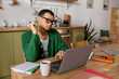 © LIGHTFIELD STUDIOS - Handsome young man working thoughtfully at home in a cozy and inviting atmosphere