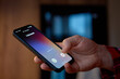 © Lazy_Bear - Closeup of hand holding smartphone with unknown incoming call on screen indoors. Concept of mobile communication, spam call and privacy risk