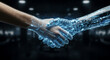 © Bluum - Human hand shaking robotic hand with digital glow. Symbol of collaboration between people and artificial intelligence. Future technology partnership and man-machine integration concept
