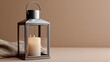 © SashaMagic - Minimalist metal lantern with lit candle on beige surface