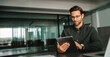 © Stock 4 You - European man working on trade online using touchpad fintech computer for business work at workplace. Young entrepreneur businessman holding digital pc tablet sitting in office. Web banner, copy space