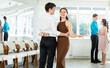 © JackF - With unhurried music, guy with girl in couple spins to rhythm of waltz during lesson for novice students. Classes in mini-groups, participants of class enjoy movement, learn to control body in dance
