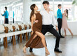 © JackF - Young man and young woman dance couple latin dances in studio