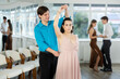 © JackF - Couple of young guy and young woman dancing waltz in studio