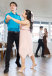 © JackF - Young man and young woman dance couple latin dances in studio