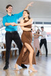 © JackF - Young couples learning to dance latin american dances in a dance studio