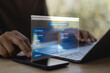 © MUNTHITA - User entering personal information on online registration form via laptop and smartphone. Digital data privacy, cybersecurity, identity verification and secure account signup concept.