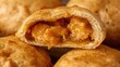 © VolumeThings - Detailed view of savory curry chicken inside a Thai curry puff