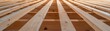 © Design@22 - Close-up, low-angle view of unfinished wooden ceiling joists, showing warm, natural wood textures and the abstract grid pattern of construction. Construction, Abstract, Wood, Texture