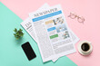 © Pixel-Shot - Newspapers, eyeglasses, cup of coffee, mobile phone and houseplant on colorful background. Top view