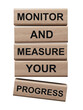 © bo - Monitor and Measure your Progress symbol. wooden blocks with words Monitor and Measure your Progress.Businessconcept.Supports PNG files with transparent backgrounds.
