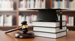 © thedesignbuy - Law and education symbolism with gavel graduation cap and stacked books