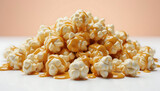 Golden caramel drizzled over fluffy popcorn pile with glossy texture for snack or dessert marketing